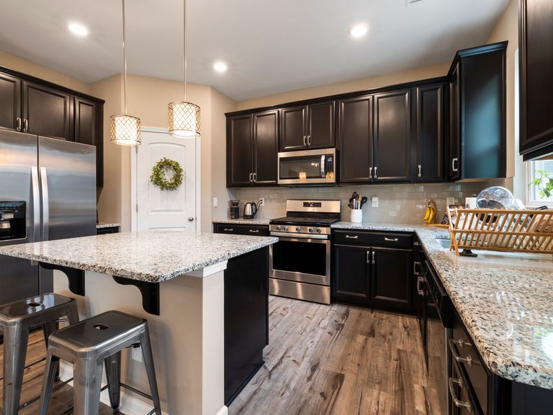 Stainless gas range and oven in a Queens kitchen