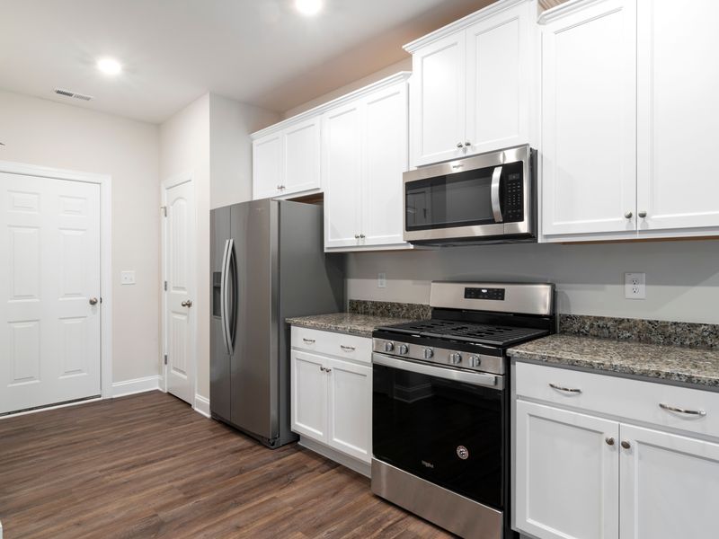 Stainless steel refrigerator in a bright Queens kitchen